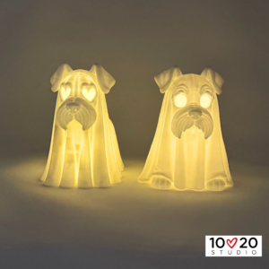 Two Standing Ghostly Schnauzer lanterns glowing with included LED tealights